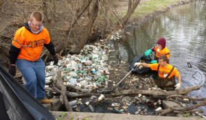 Volunteers clear trash from the river channel. Photo: KSU Pollution Prevention Institute